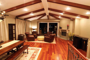 A stylish living room with a table and chairs, showcasing Creative Solutions' modern design approach.